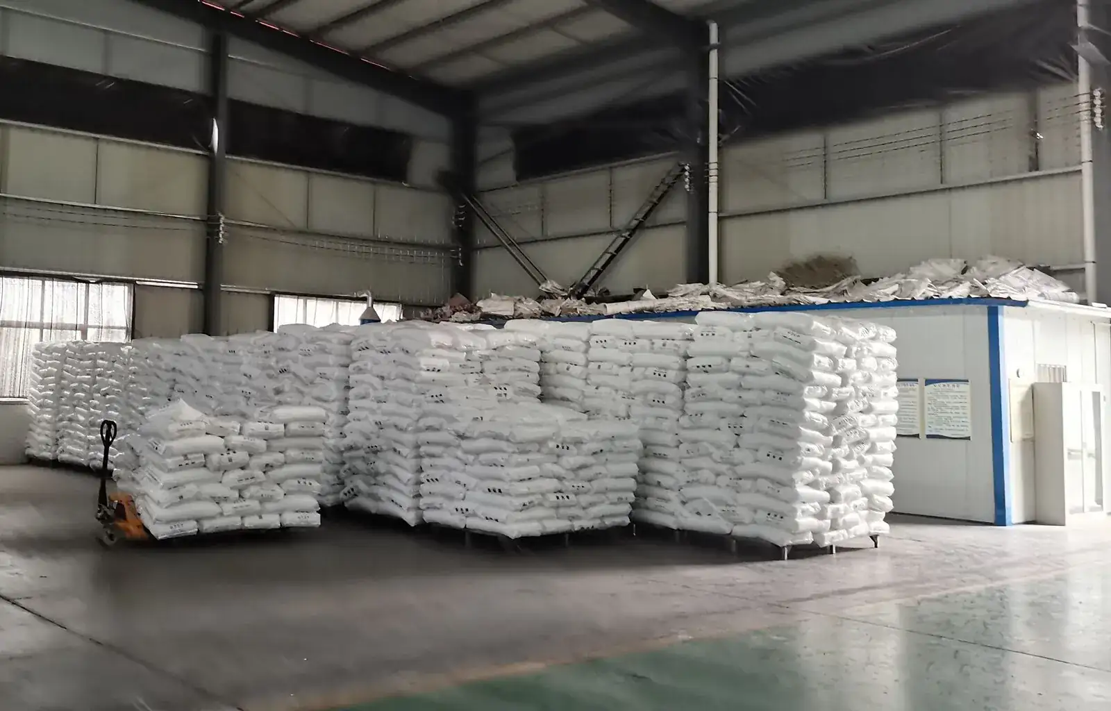 Warehouse with stacked bales of finished FIBC bags